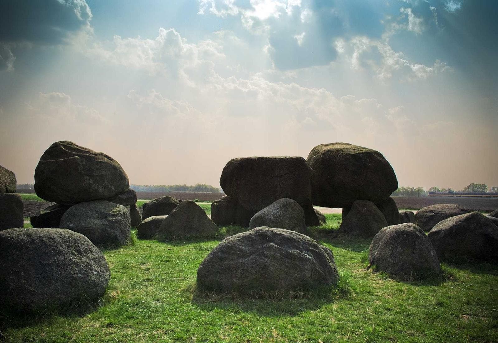 Massive natural stones resting on turf